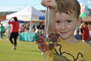 Boy holding a painted butterfly